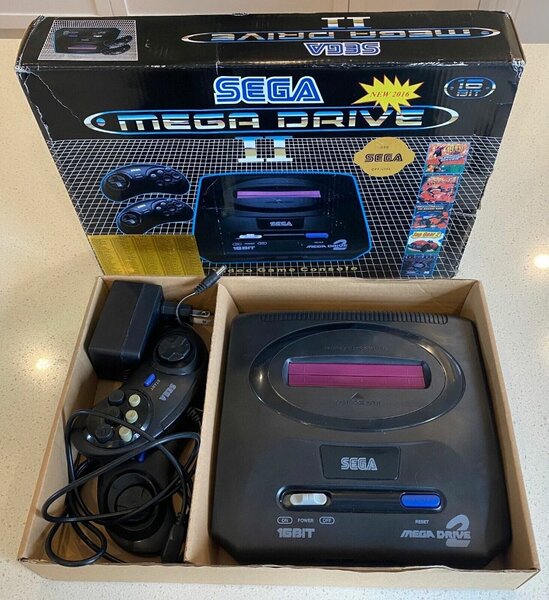 Sega Mega Drive II with games inside including Sonic