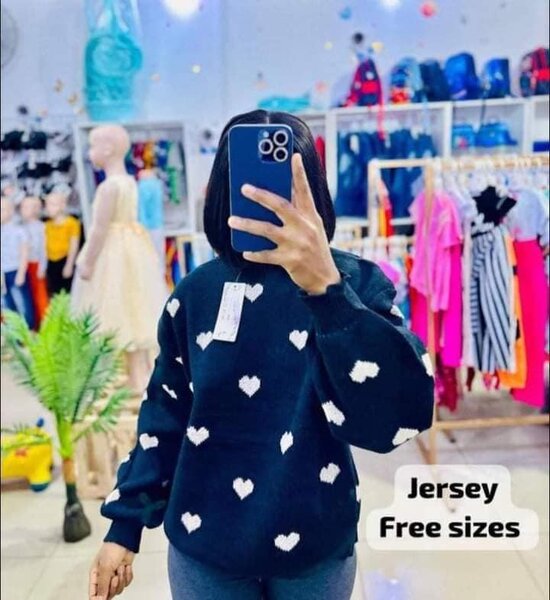 Black sweater with white heart print