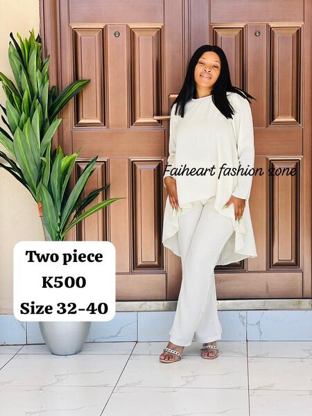 Women's suit is white, long-sleeved tunic and trousers SIZE 32-40
