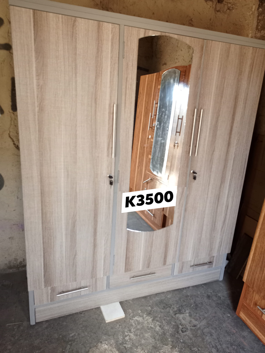 light brown wardrobe with mirror