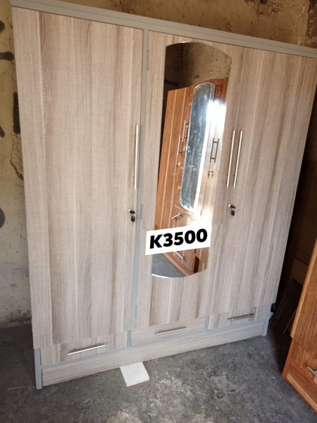 light brown wardrobe with mirror