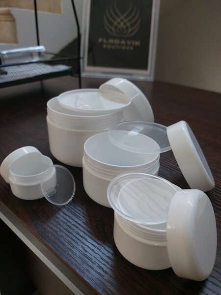 White jars with inner covers