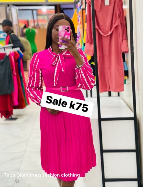 Pink dress with white decoration on the sleeves