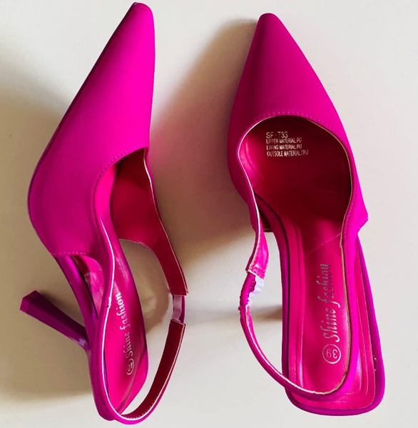 Women's pumps are bright pink with a pointed toe and an ankle strap