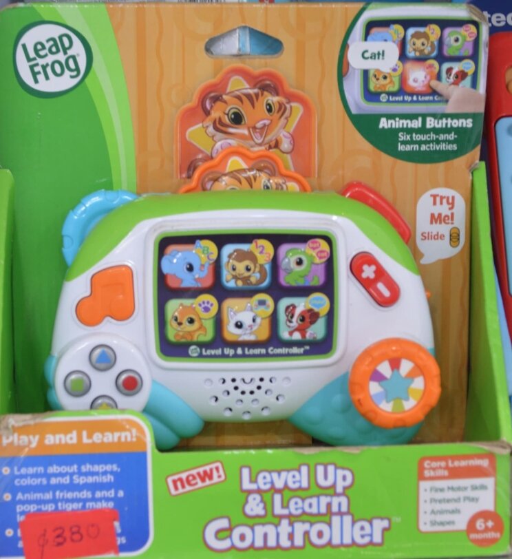 Musical toy for babies Play and Learn! O Learn about shapes, O colors and Spanish Animal friends and a pop-up tiger make