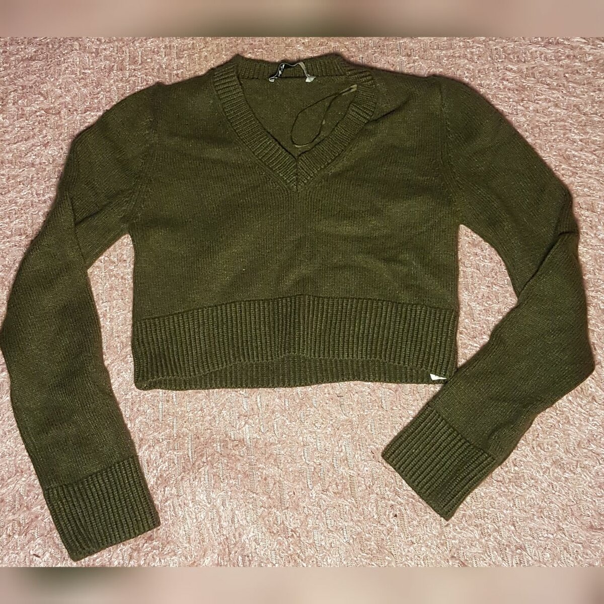 Pull court en maille verte