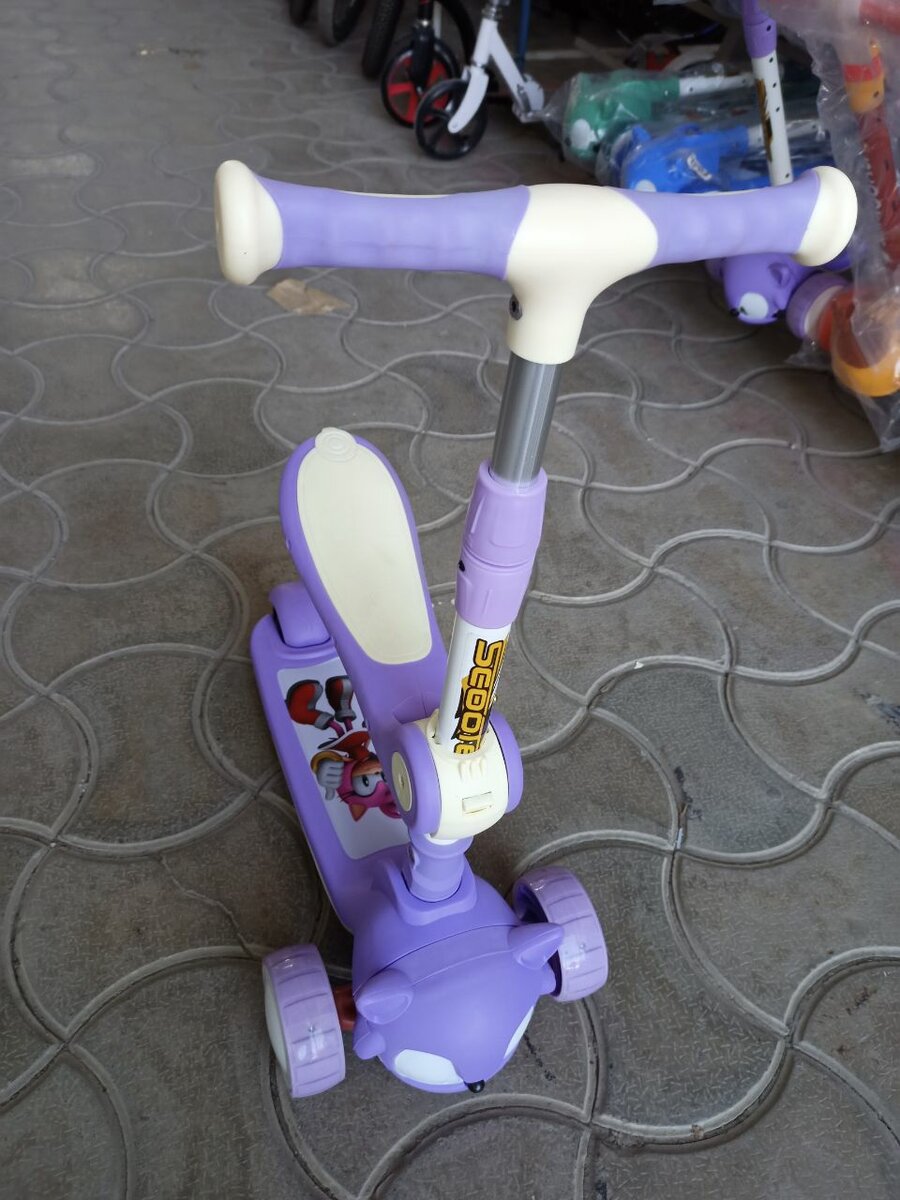 Детский самокат сидением