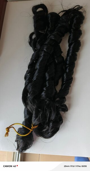 Extensions cheveux naturels bouclés