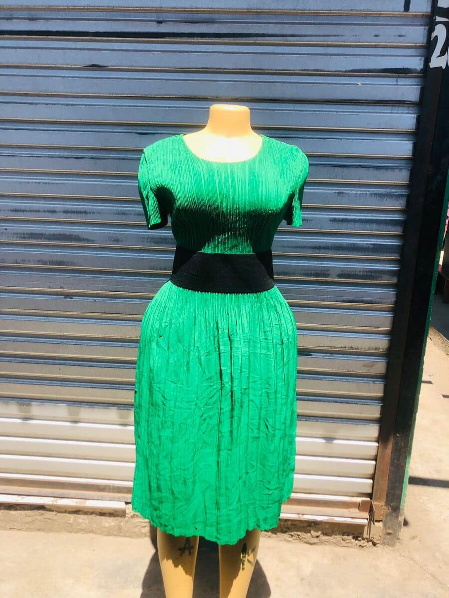 Green midi dress with fitted top and black belt