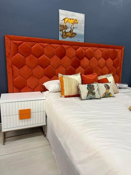 bed with orange headboard