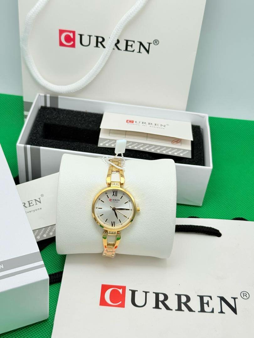 Montre CURREN dorée élégante