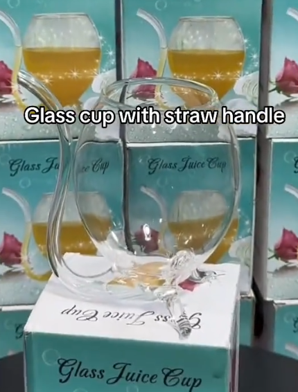 Glass tumbler with a straw