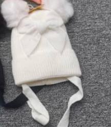 Hat with pompon for a girl white