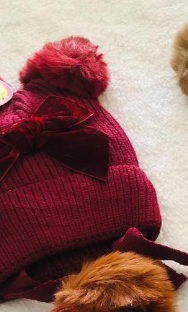 Hat with pompon for a girl red