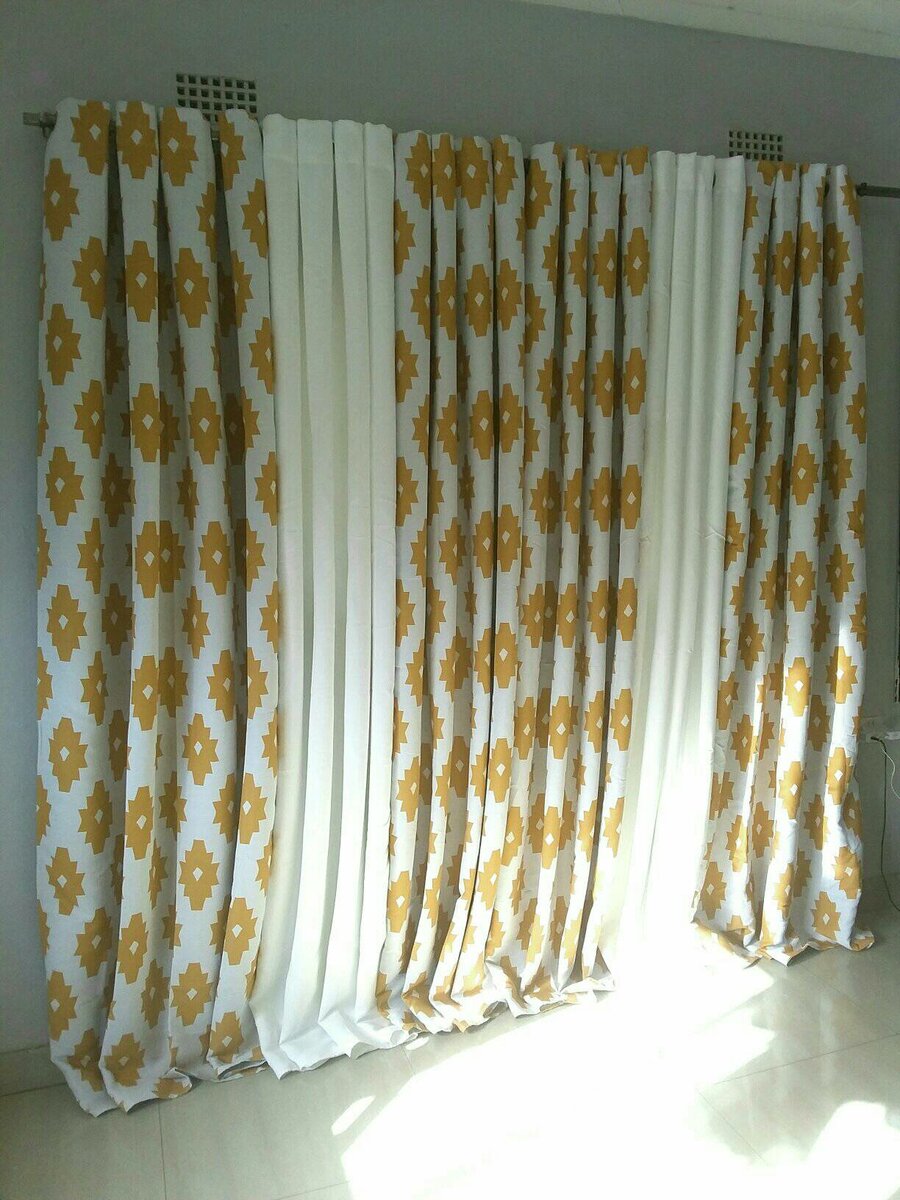 2 drops of curtains white and white with orange patterns