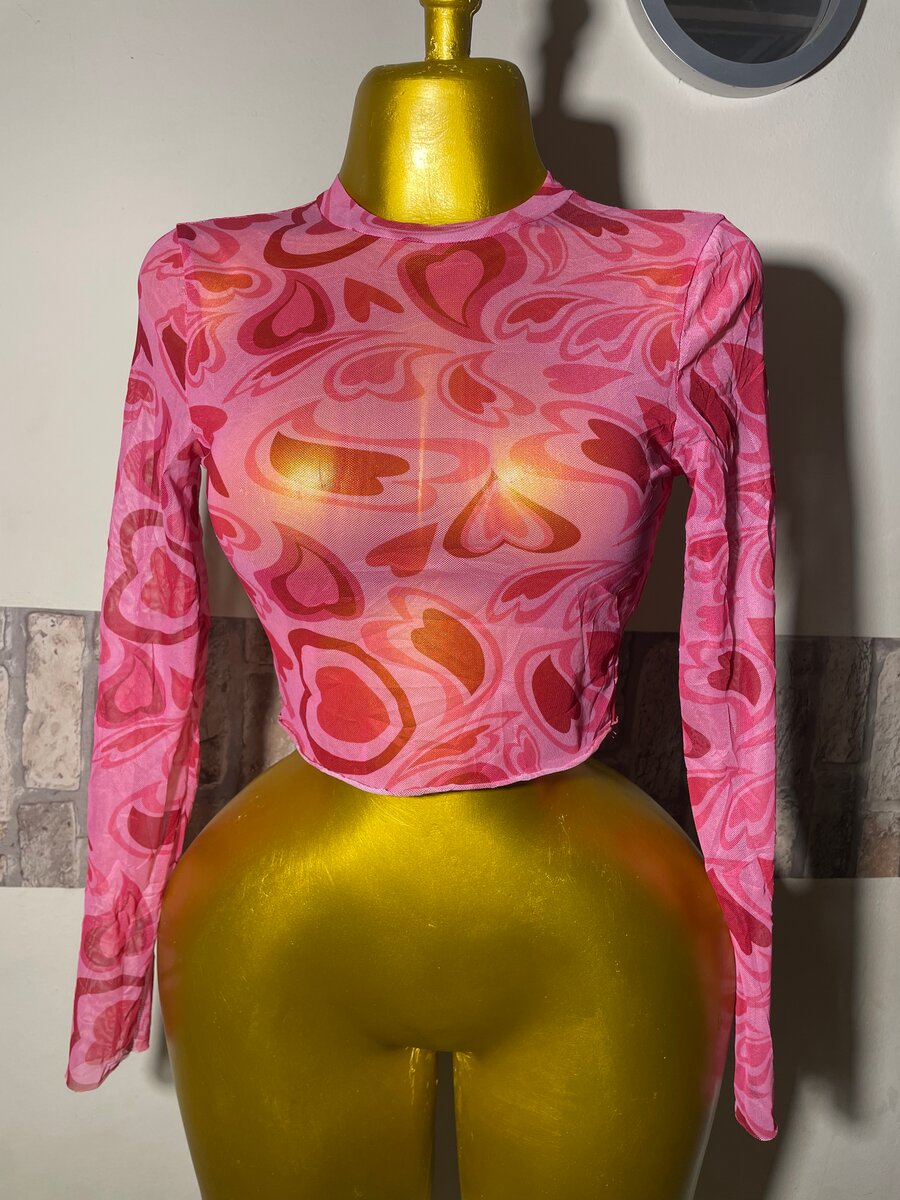 Haut transparent à motifs rose