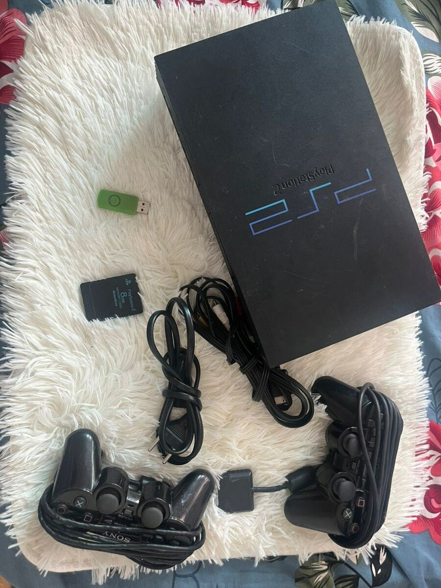 Console PS2 avec manettes