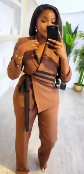 Women's light brown suit with black inserts