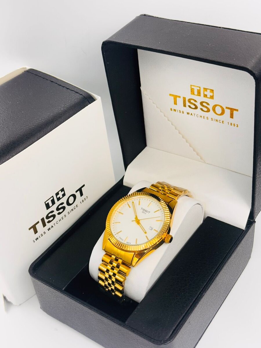 Montre Tissot en or avec bracelet métallique