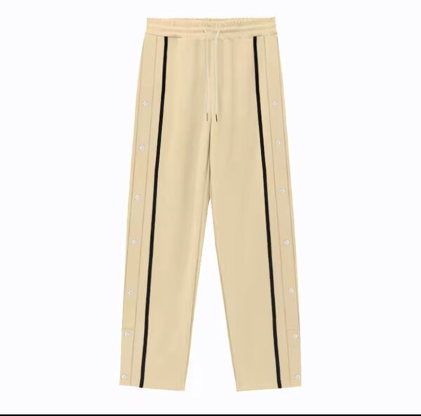 Pantalon de sport à boutons latéraux