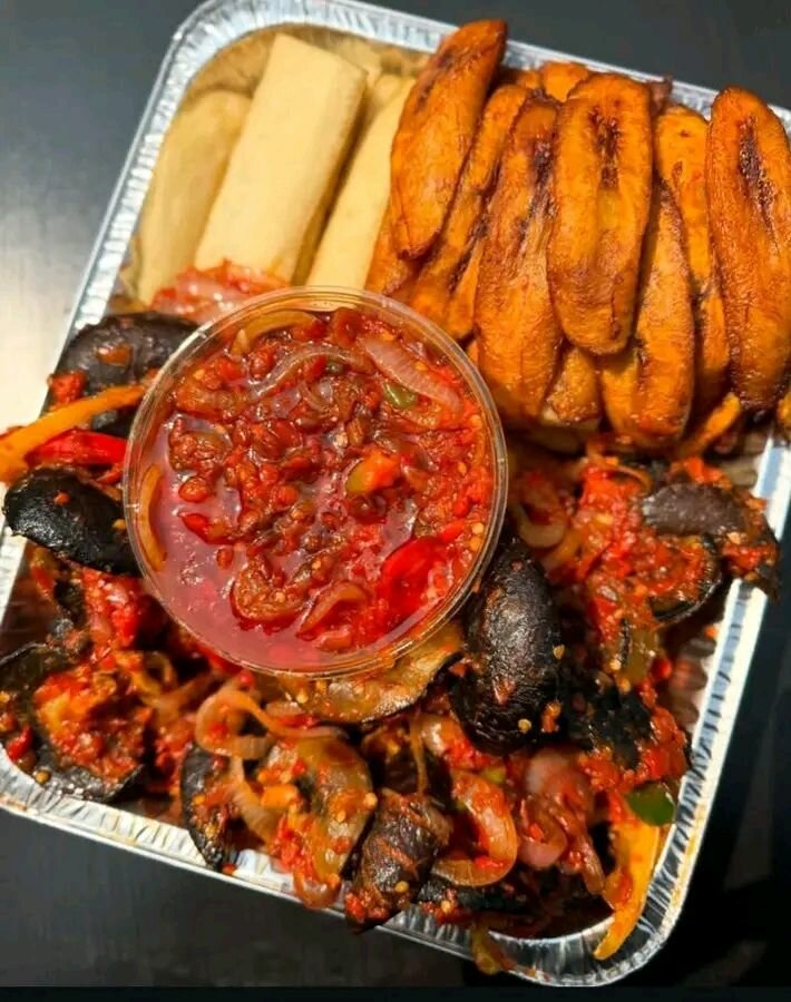 Fried yam and peppered snail and beef