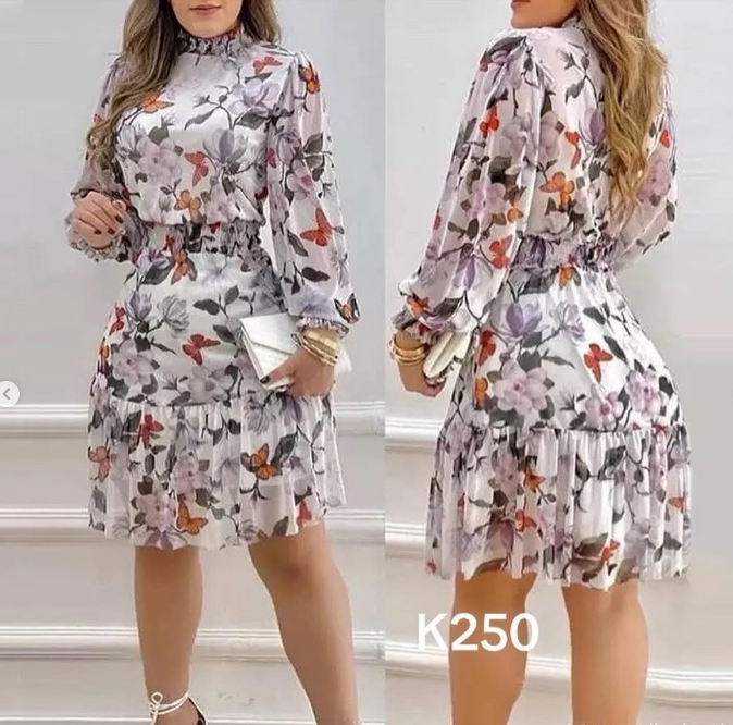 Women's dress with floral print and ruffles, with long sleeves.