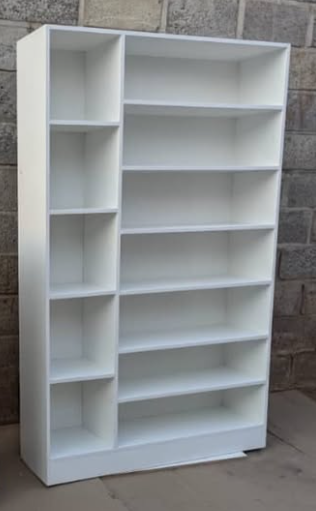 A cabinet with open shelves