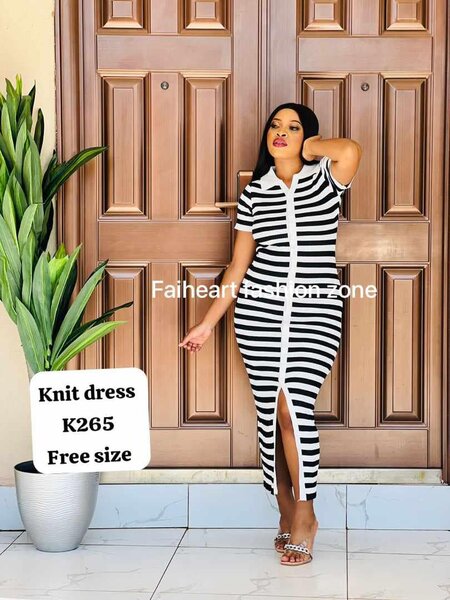 Knitted women's dress with a stripe of a free size 