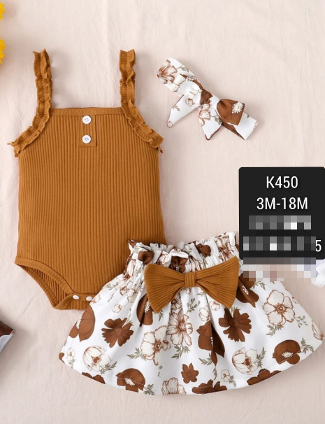 a white and brown set of bodysuit clothes, a skirt and a headband