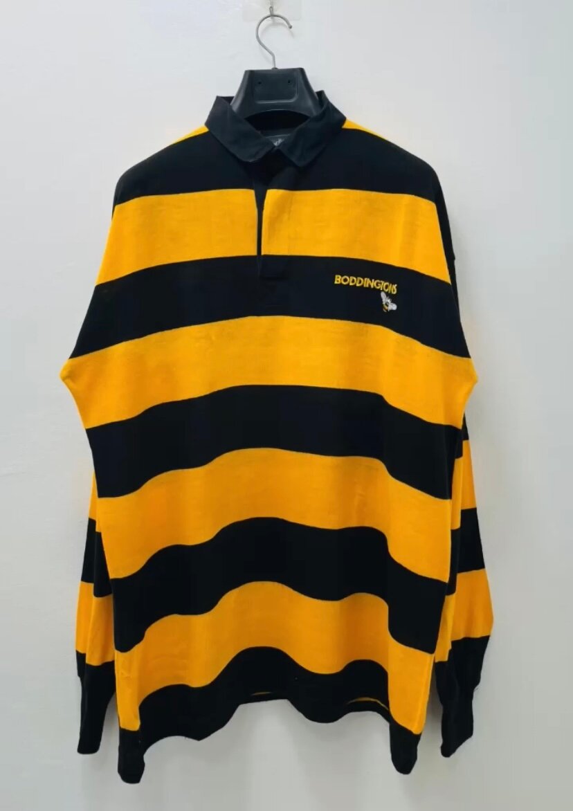 Polo rayé jaune et noir