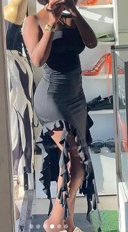 Asymmetrical dress, deep cutouts on the sides at the hem, black