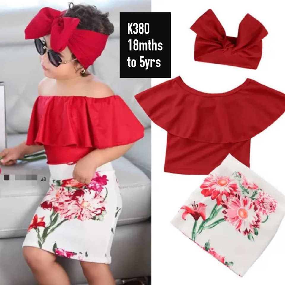 red top, printed skirt and red headband