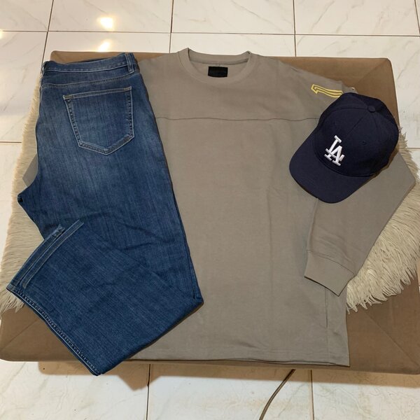 Cap, sweater and jeans trouser