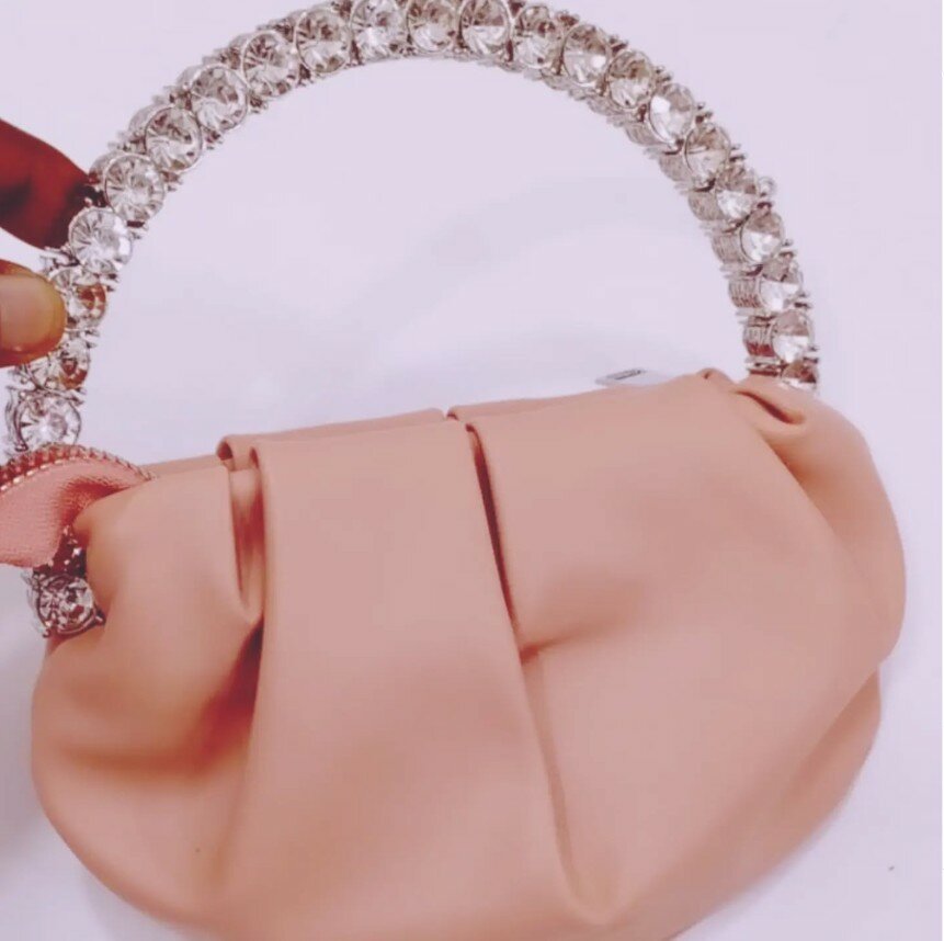 Beige clutch, handle with large rhinestones