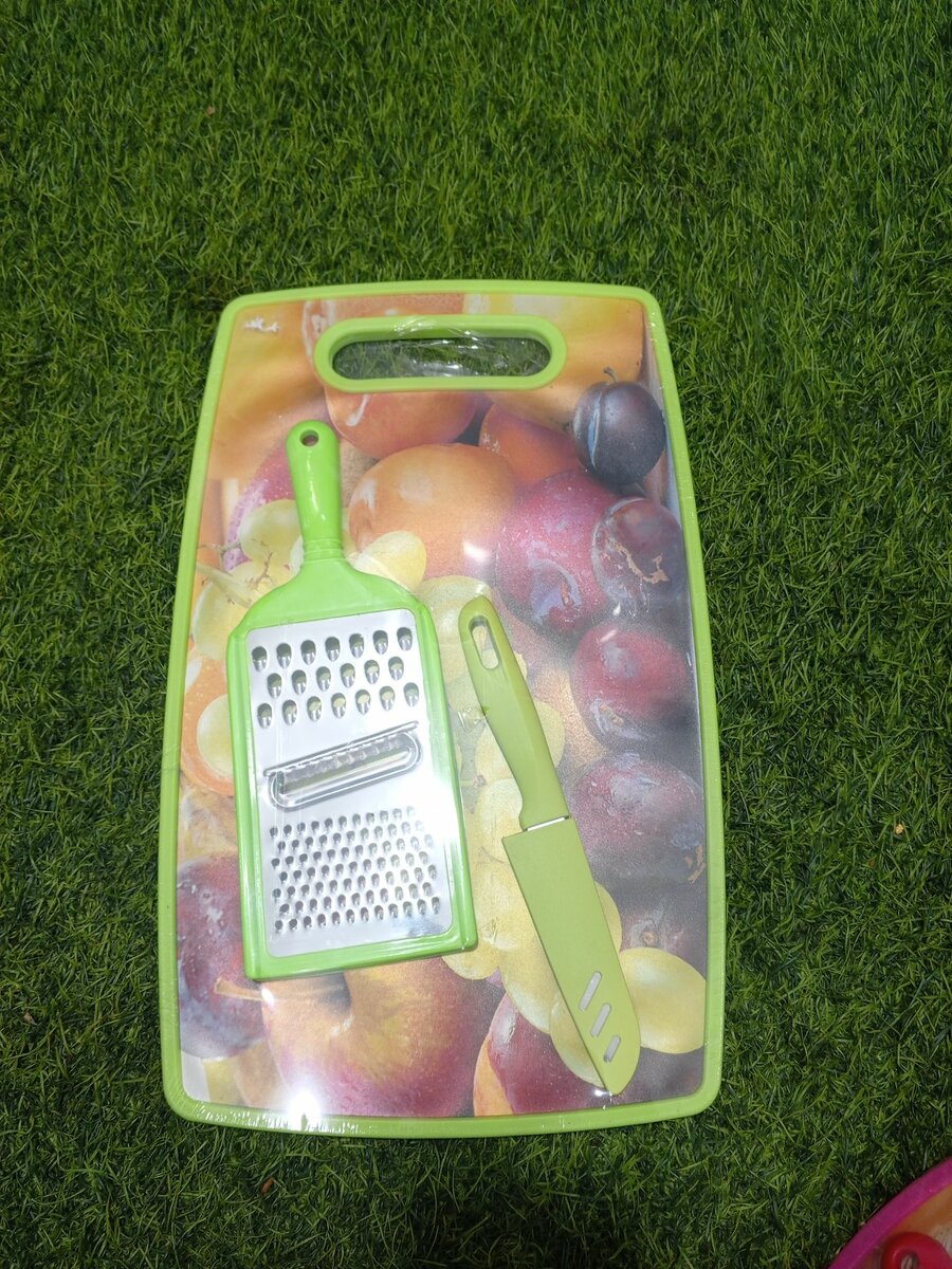 Chopping board, grater and knife