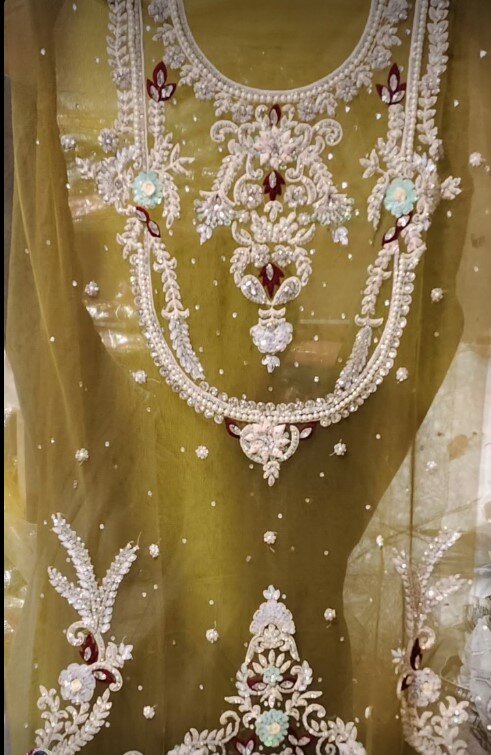 Beautiful and stylish women's outfit decorated with embroidery