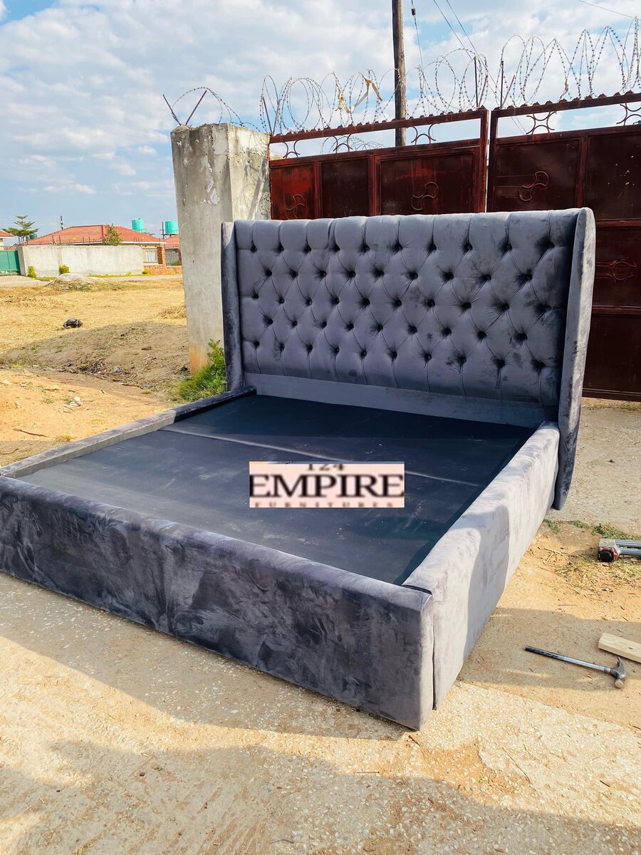 Large bed with grey upholstery