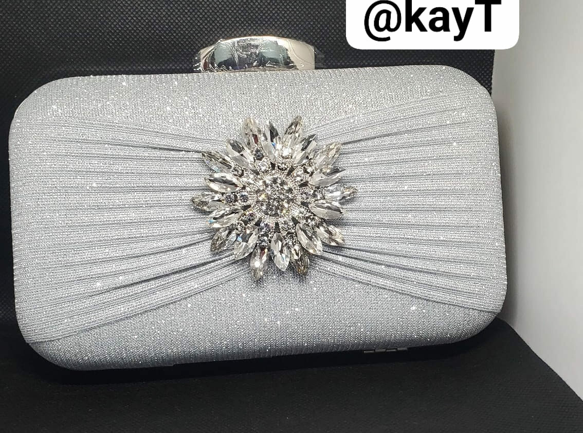 Silver clutch shiny with brooch