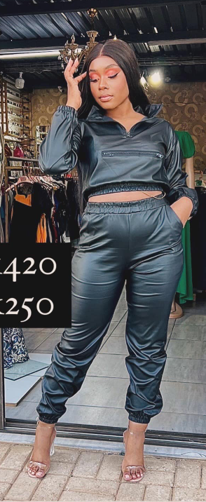 Black women's suit, trousers and a short top with long sleeves