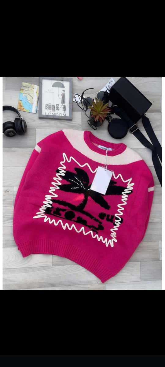 Pull rose à motif