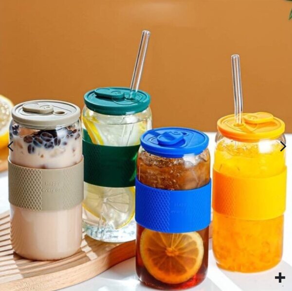 Glass tumbler with silicone lid and sleeve