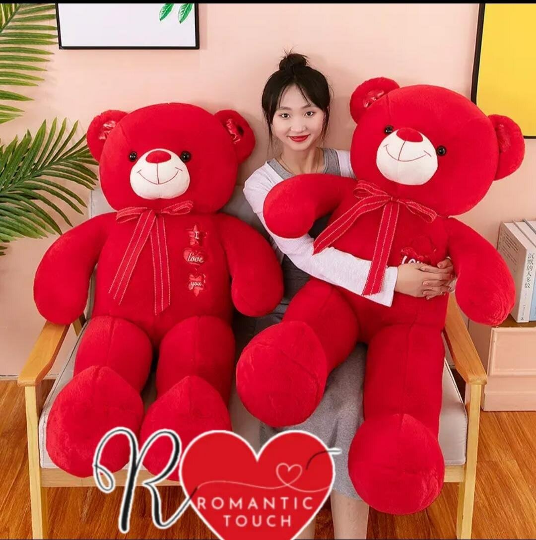 Ours en peluche rouge géant