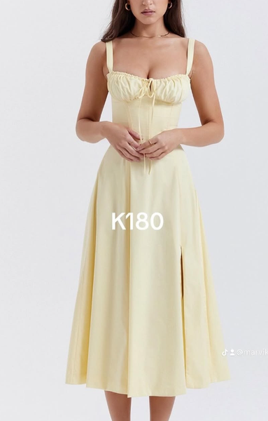 Women's yellow dress with a drawstring and a flared skirt.