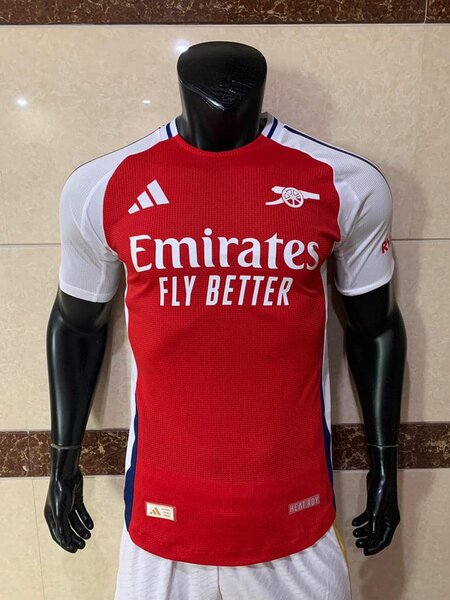 Arsenal men's football uniform in red and white, with the logos of Adidas and Emirates Fly Better