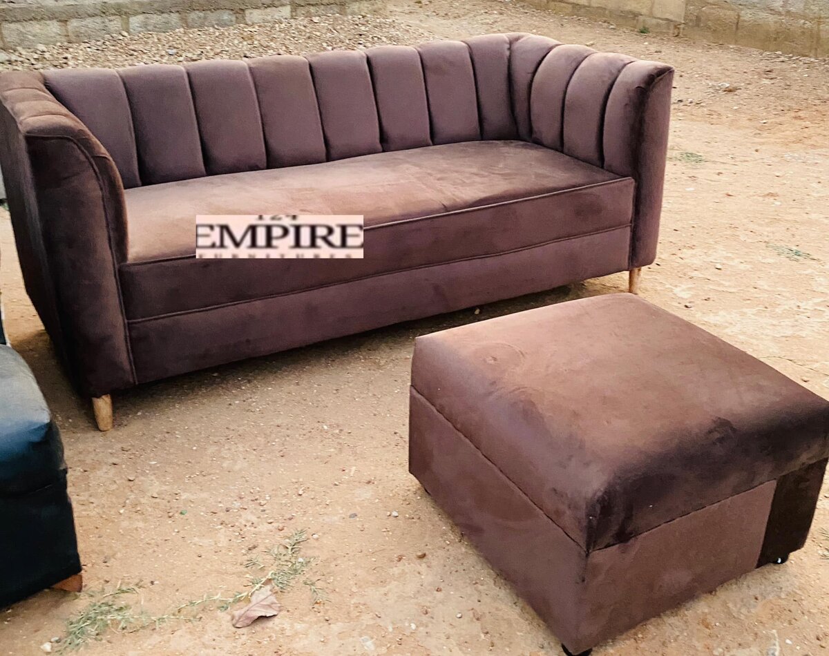 Brown upholstered sofa and ottoman