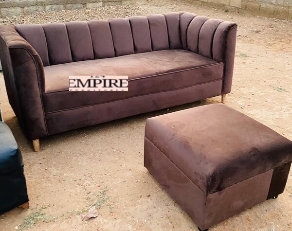 Brown upholstered sofa and ottoman