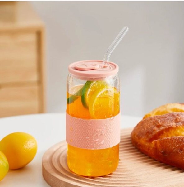 Glass tumbler with silicone lid and sleeve