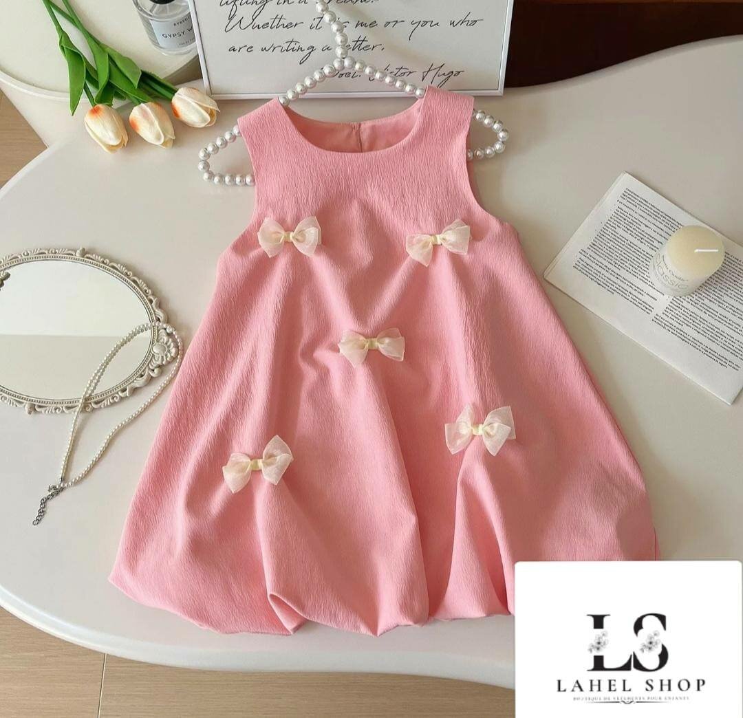 Robe rose à nœuds pour fille