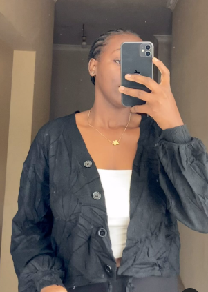 Short knitted cardigan with buttons in black size:M