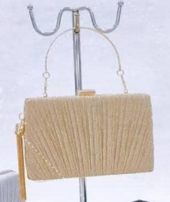 Women's clutch bag in golden color